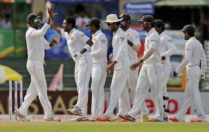 Sri Lankans celebrate a wicket on Day 3
