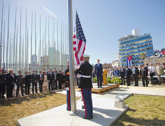 US Secretary of State John Kerry (C) stands with other dignitaries during the raising of the US flag over the newly reopened embassy in Havana, Cuba on August 14, 2015.