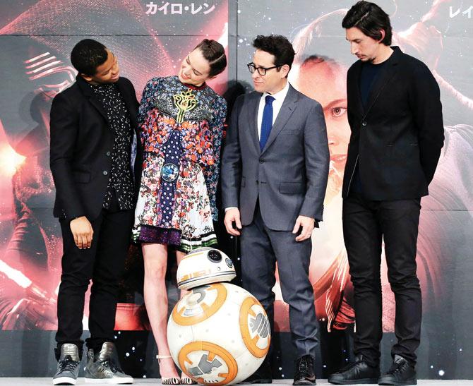 (From left) John Boyega, Daisy Ridley, JJ Abrams and Adam Driver with BB-8 at the press conference for Star Wars: The Force Awakens. pic/Getty Images