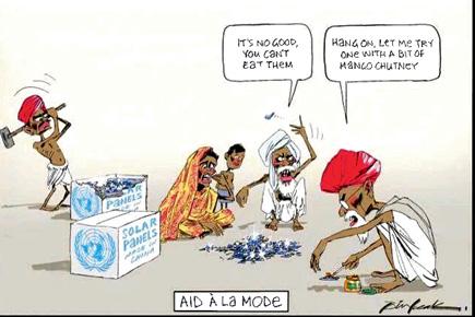 'Racist' Aus cartoon shows Indians eating solar panels