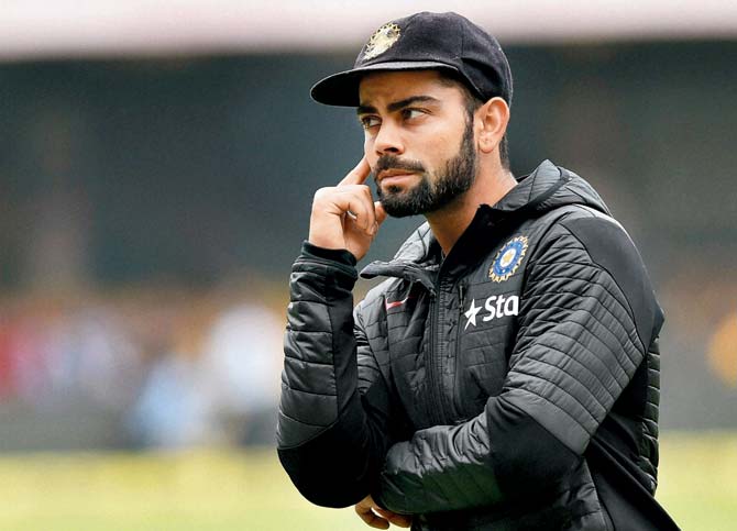 Virat Kohli before the start of the second Test against South Africa at the Chinnaswamy Stadium in Bangalore in November. Pic/PTI