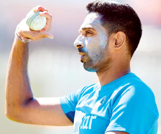 Pacer Dhawal Kulkarni prepares to bowl during a practice session ahead of India