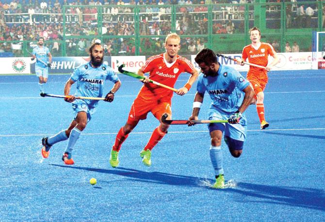Indian players vie with their Dutch counterparts during their pool match yesterday. Pic/PTI