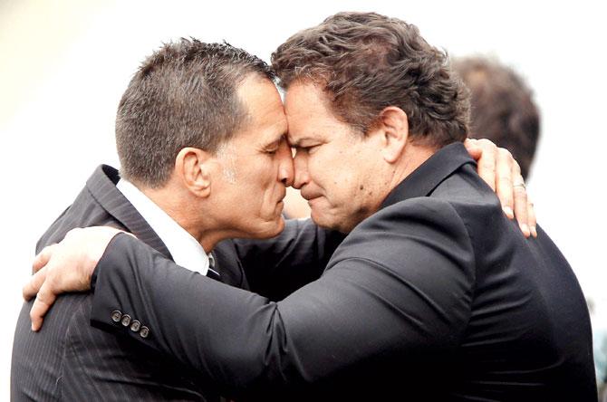 Former All Blacks Dalls Seymour (left) and Michael Jones perform a hongi after the memorial service of late All Blacks rugby legend Jonah Lomu at Eden Park in Auckland yesterday. Pic/AFP