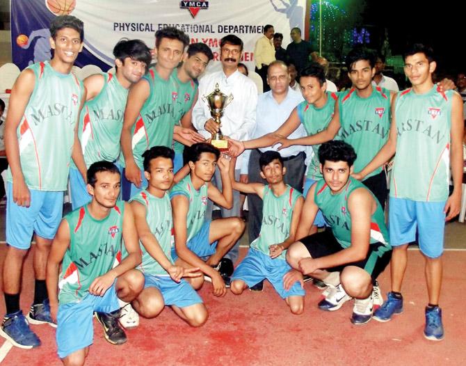 The victorious Mastan junior boys team pose with the trophy