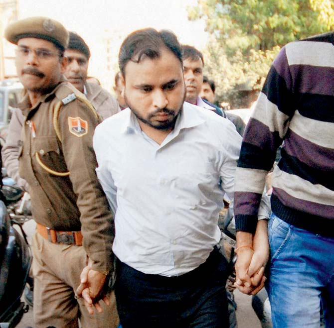 Suspected ISIS agent Mohammad Sirajuddin is escorted to a Jaipur court on Friday. Through him, the ATS tracked down a teenage girl in Pune who had plans to join the IS in Syria. Pic/PTI