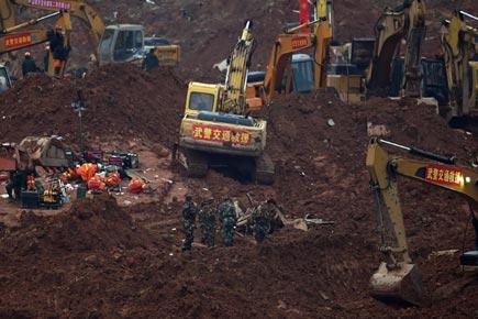 First body recovered from China landslide, 85 still missing