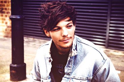 Louis Tomlinson gets a tattoo on his derriere?