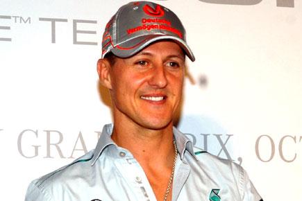 Michael Schumacher can walk, claims magazine; manager denies