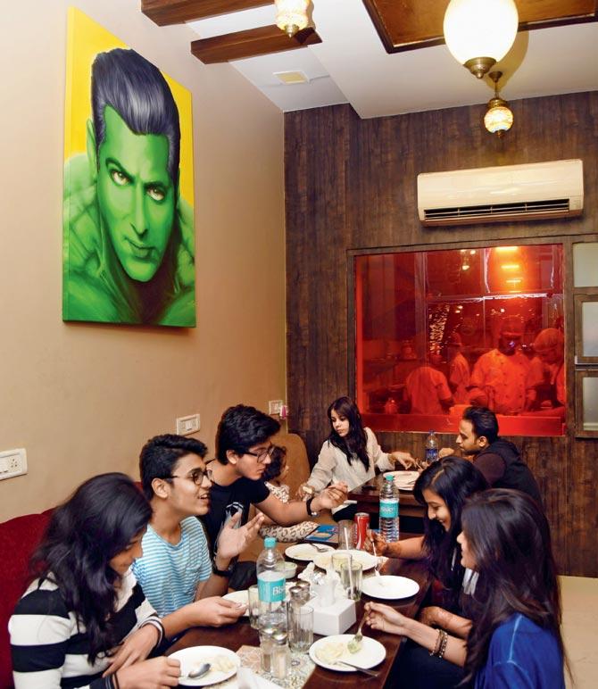 A Salman Khan poster dominates a wall at Bhaijaanz