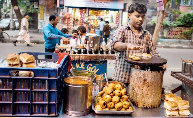 Bapi opened this stall in Kankurgachi one year ago. He sells vada pav at Rs 15 apiece. 