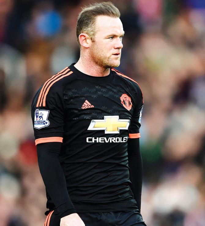 Wayne Rooney, who was brought in the second half against Stoke, looks dejected as he walks off after the loss on Saturday. Pic/Getty Images