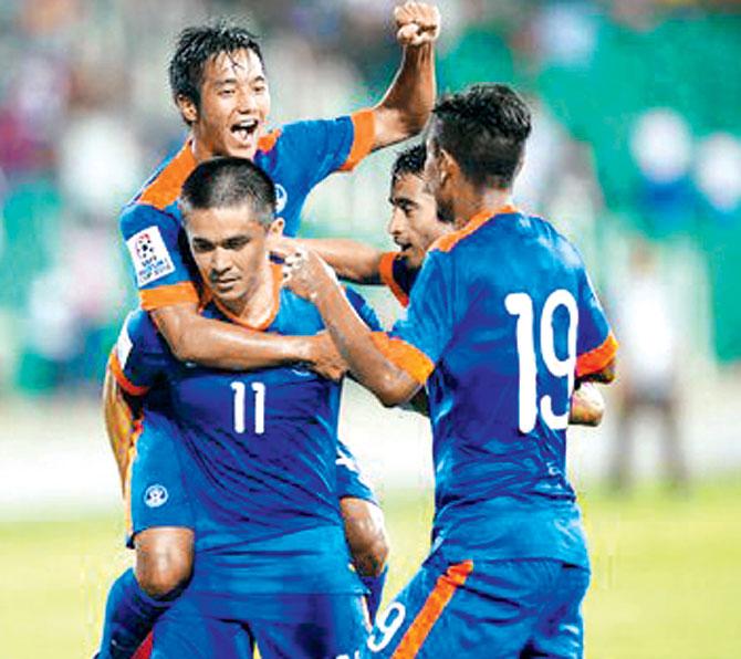 Eighteen-year-old Chhangte Lallianzuala climbs atop skipper Sunil Chhetri (jersey No 11) to celebrate one of India