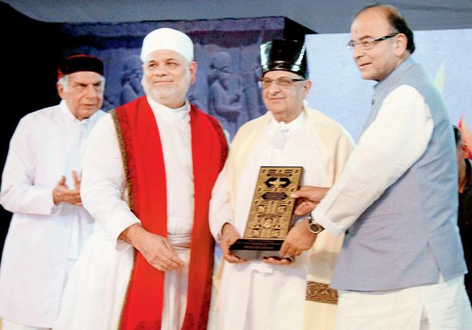 Flanked by industrialist Ratan Tata (extreme left) Union Finance Minister Arun Jaitley felicitates Dr Cyrus Poonawalla (second from right) on the last day of Iranshah Udvada Utsav yesterday. pic/pti 
