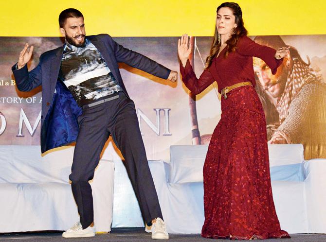 Play the casual chic card like Ranveer Singh and Deepika Padukone, and dabble with prints and colour pic/afp