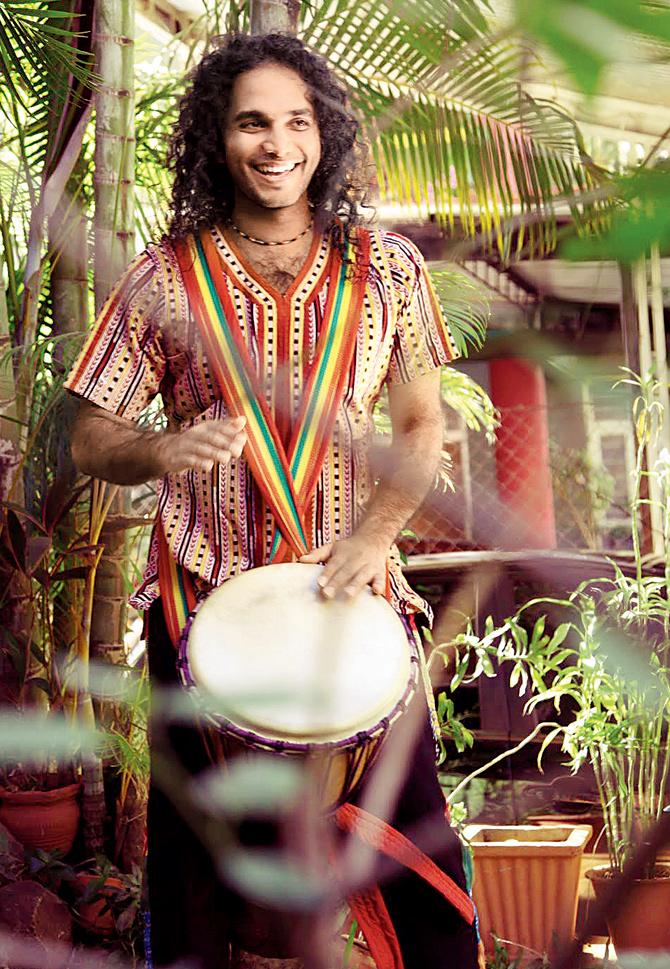Varun Venkit plays the djembe