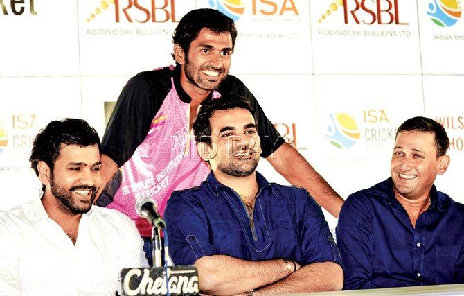 A beaming Abhishek Nayar stands behind his Mumbai cricket mates Rohit Sharma (left), Zaheer Khan and Ajit Agarkar during the launch of his academy at Wilson College Gymkhana yesterday. Pic/Shadab Khan