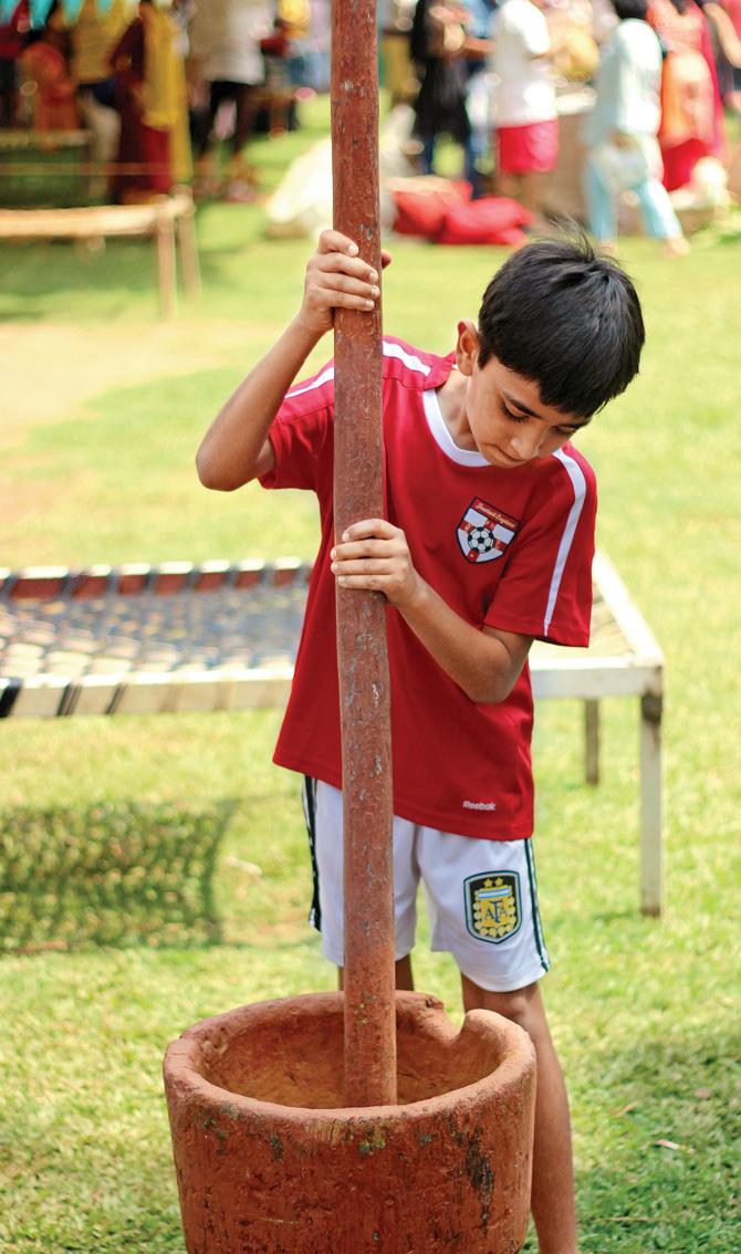 A child participating in an activity at the first edition of Mumbai Organic Fest 
