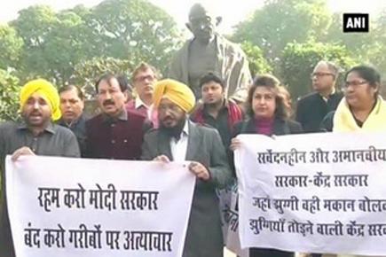 Delhi slum demolition: AAP, TMC protest at Gandhi statue outside Parliament