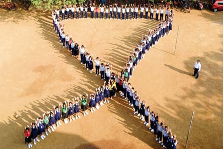 Thane: Students symbolise red ribbon to create AIDS awareness