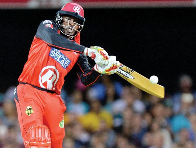 Melbourne Renegades’ Chris Gayle with his gold-coloured bat during the BBL tie vs Brisbane Heat in Brisbane on Saturday. PIC/Getty Images