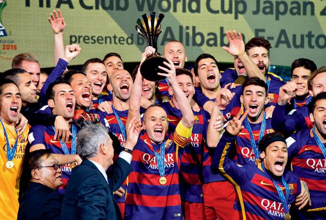 FC Barcelona captain Andres Iniesta (centre) celebrates the Club World Cup win with his teammates in Yokohama yesterday. PIC/AFP