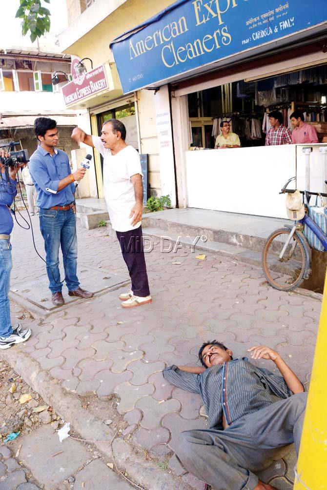 Francis Fernandes, an eyewitness was seen giving an interview at the spot on Hill Road, where Salman Khan’s Land Cruiser had claimed a life on that fateful September day in 2002. However, what caught our eye was a man lying on the pavement, seeming oblivious to the fact that this pavement was once home to several others like him, who slept one night and never woke up. Pic/Pradeep Dhivar