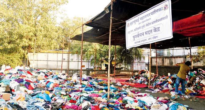 Donated clothes lie in the rehabilitation help centre started by the BMC at Damu Nagar