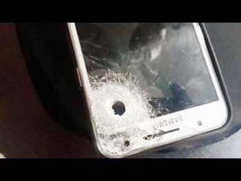 The bullet was fired at from close range, and could have proved fatal had it not hit the mobile phone