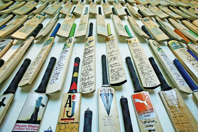 A selection of cricket bats signed by the best players in the world on display at the Shyam Bhatia Cricket Museum in Dubai on June 10, 2014. Pic/Getty Images