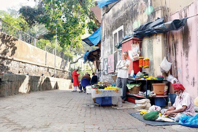 The entrance of Siri Road where Jahangir Shaikh’s family has sold flowers for more than 100 years. He says, “Where will I go? My father, his father and all before me all made flowers to adorn the deities in the temples that are along this road.”