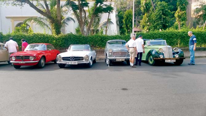 A fleet of vintage cars, belonging to Classic Drive Group, at Horniman Circle