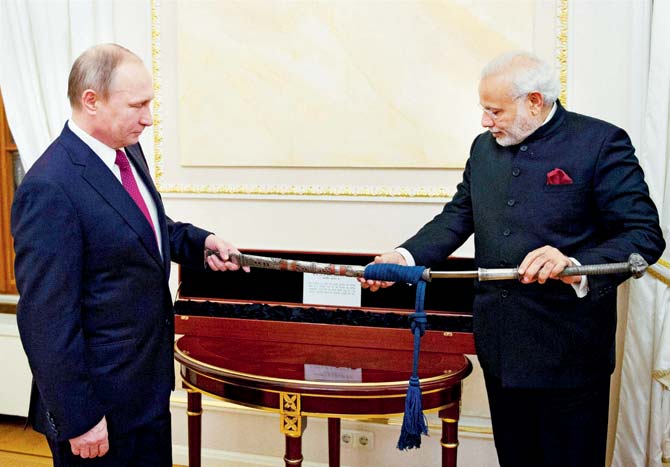 An antique sword that features intricate silver artwork to Prime Minister Narendra Modi in Kremlin. Pics/PTI