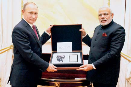 Vladimir Putin gifts Bapu's handwritten notes, Bengal sword to Narendra Modi