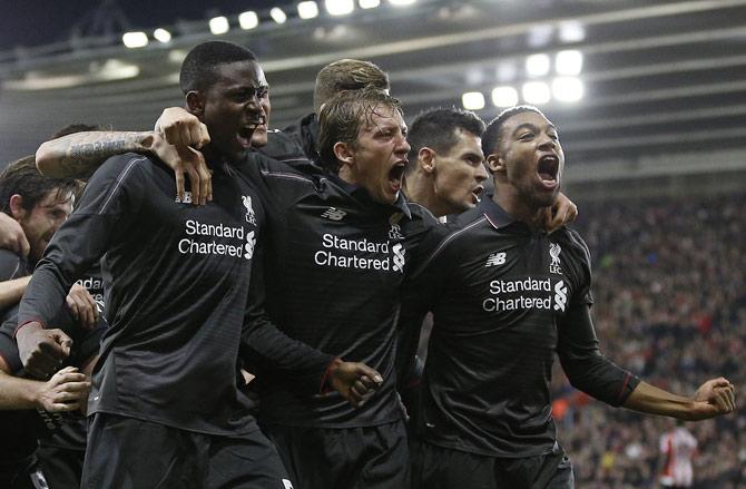 Liverpool players celebrate their win