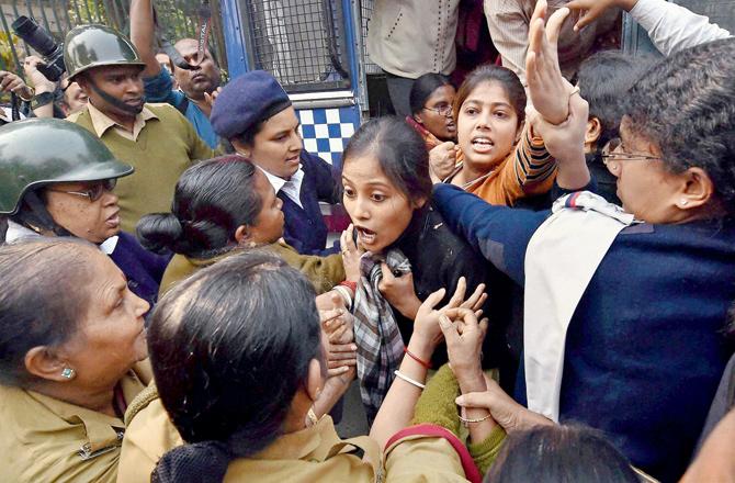 Police detained members of All India Democratic Students’ Organisation (AIDSO) protesting against the gangrape in front of Raj Bhavan in Kolkata yesterday. 