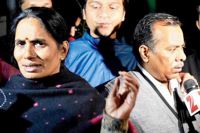 Nirbhaya’s parents speak to reporters after leaving the Parliament following the passage of the Juvenile Justice Bill yesterday. Pic/Pti