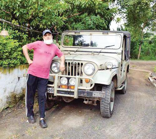Salman’s cousin Mubin Khan posing in front of the jeep that Salman used to learn driving on