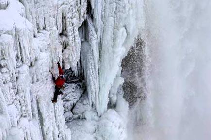 Daredevil climber becomes first ever to scale frozen Niagara Falls