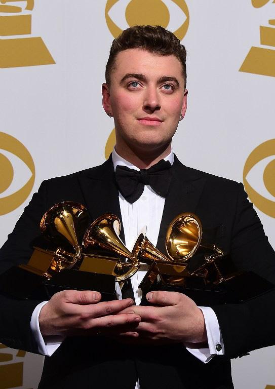 Sam Smith poses with his four trophies at the 57th Annual Grammy Awards in Los Angeles