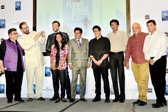 THINK YOU CAN DO BETTER? Actor Kabir Bedi (second from l), who read excerpts from the book, Flash Point, seems to ask writer Fahad Samar at the book launch. Chief photographer of mid-day Rane Ashish is third from right. PIC/SATYAJIT DESAI 