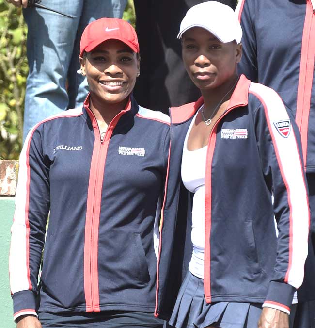 US tennis players Serena Williams (L) and her sister Venus gesture before the start of the 2015 Fed Cup World Group II first round seroes against Argentina at Pilara Tennis Club in Pilar Buenos Aires. Pic/AFP