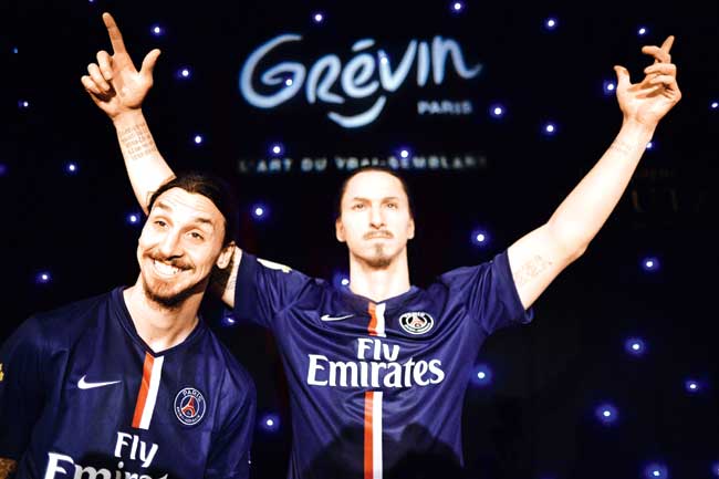 Zlatan Ibrahimovic poses next to his wax statue. Pic/AFP