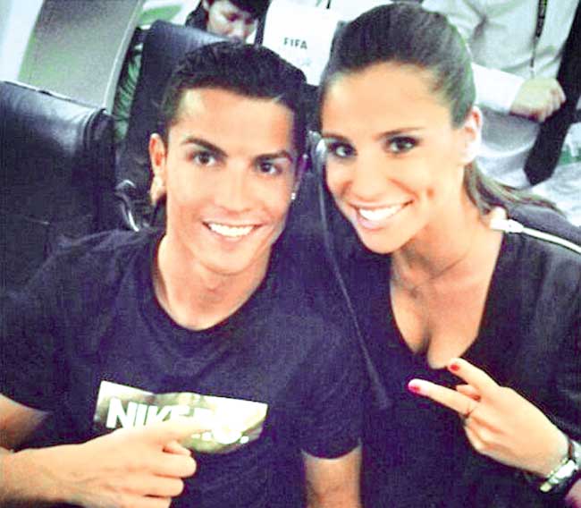 Spanish TV reporter Lucia Villalon poses with Cristiano Ronaldo