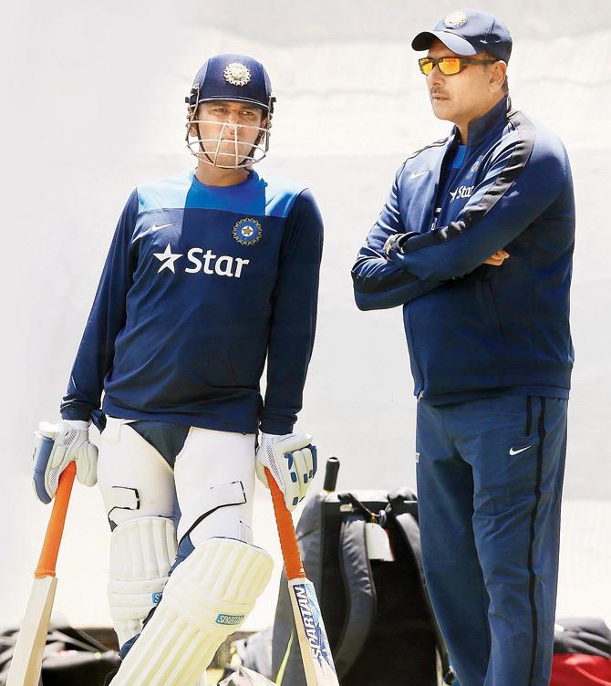 India skipper MS Dhoni (left) with Ravi Shastri. Pic/Getty Images