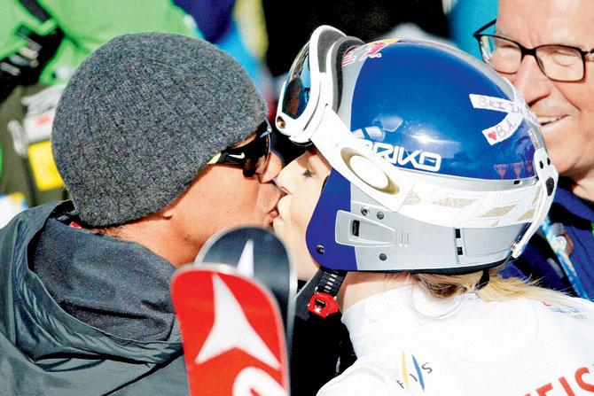 Tiger Woods (left) kisses Lindsey Vonn during the women’s giant slalom competition at the Alpine skiing World Championships in Beaver Creek, Colorado. PIC:AP/PTI