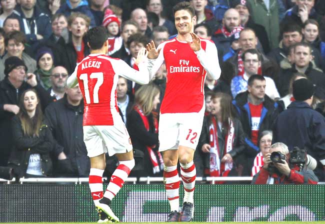 Arsenal-s French striker Olivier Giroud R celebrates scoring his and his team-s second goal with Arsenal-s Chilean striker Alexis Sanchez L during the English FA Cup fifth round football match between Arsenal and Middlesbrough at the Emirates Stadium in London. Pic/AFP