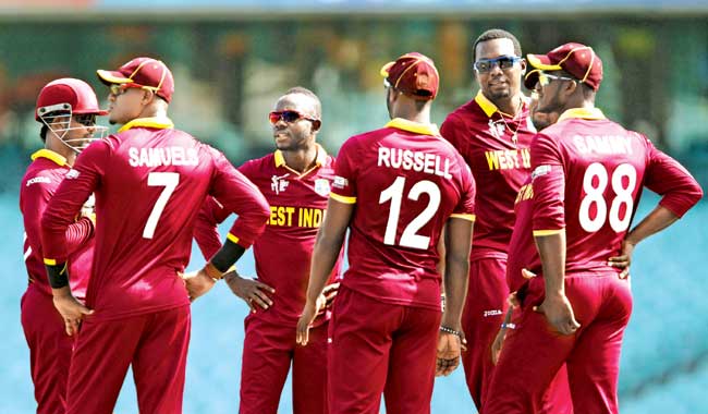 West Indies players celebrate a Scotland wicket during their warm-up match at Sydney Cricket Ground on Thursday. Pic/Getty Images