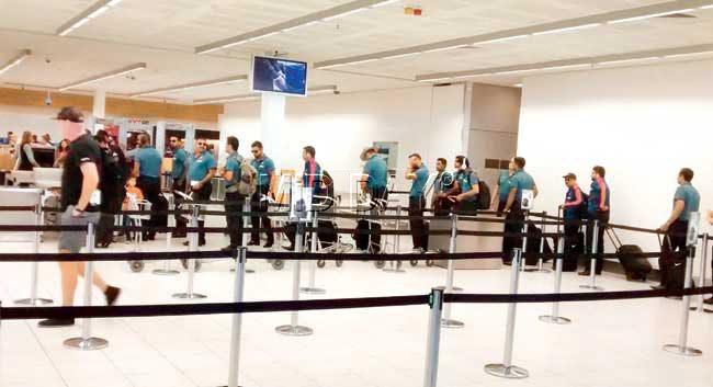 The Indian team stands in a queue for their security check before boarding a flight to Melbourne at Adelaide airport yesterday