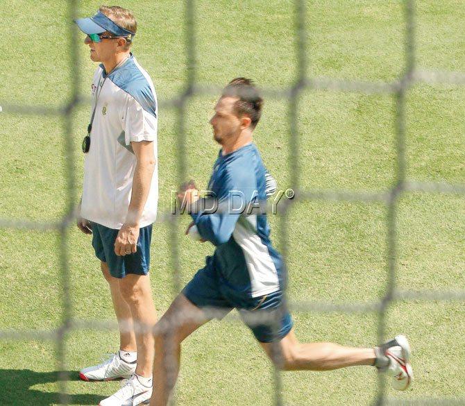 Dale Steyn bowls in the nets as coach Allan Donald watches him. Pic/Suman Chattopadhyay